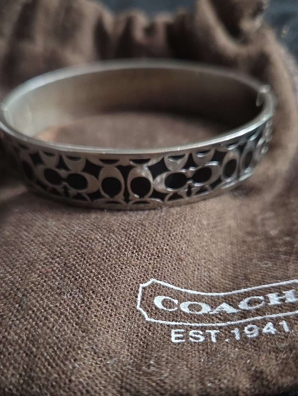 Coach Silver-Tone Signature Cutout Bangle Bracelet